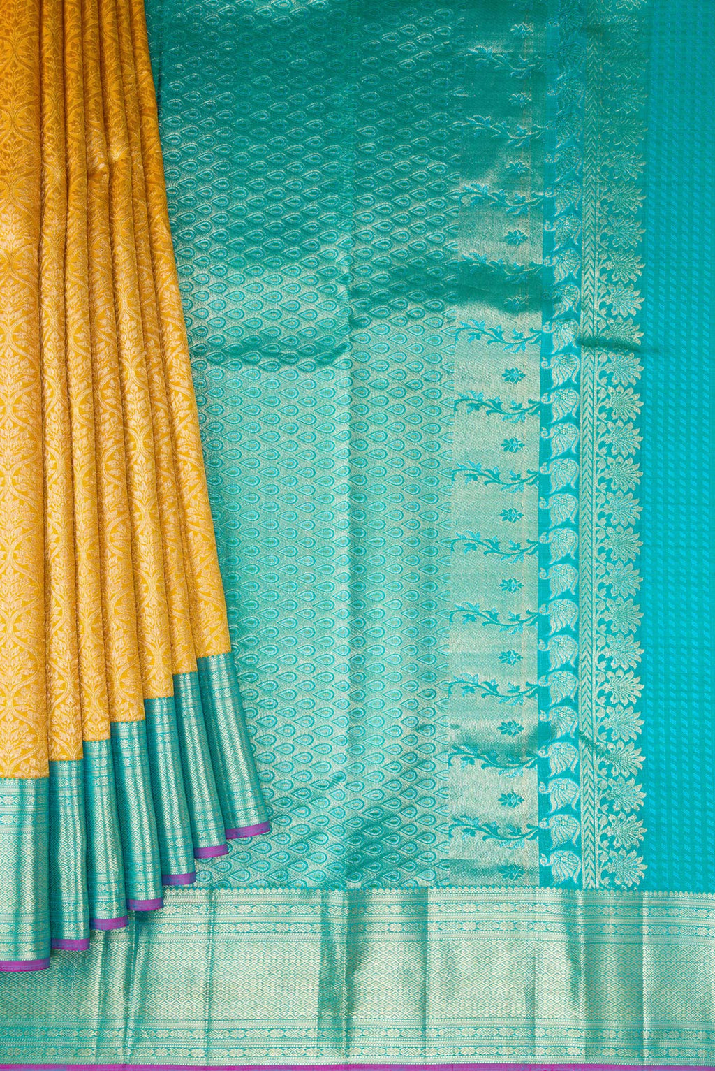 Pleats and pallu of Mustard Dual Tone Kanchipuram Silk Saree with Zari Brocade on the body and Zari Border. 