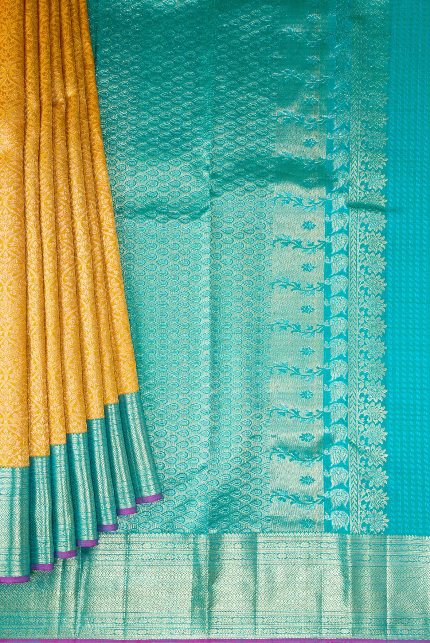 Pleats and pallu of Mustard Dual Tone Kanchipuram Silk Saree with Zari Brocade on the body and Zari Border. 