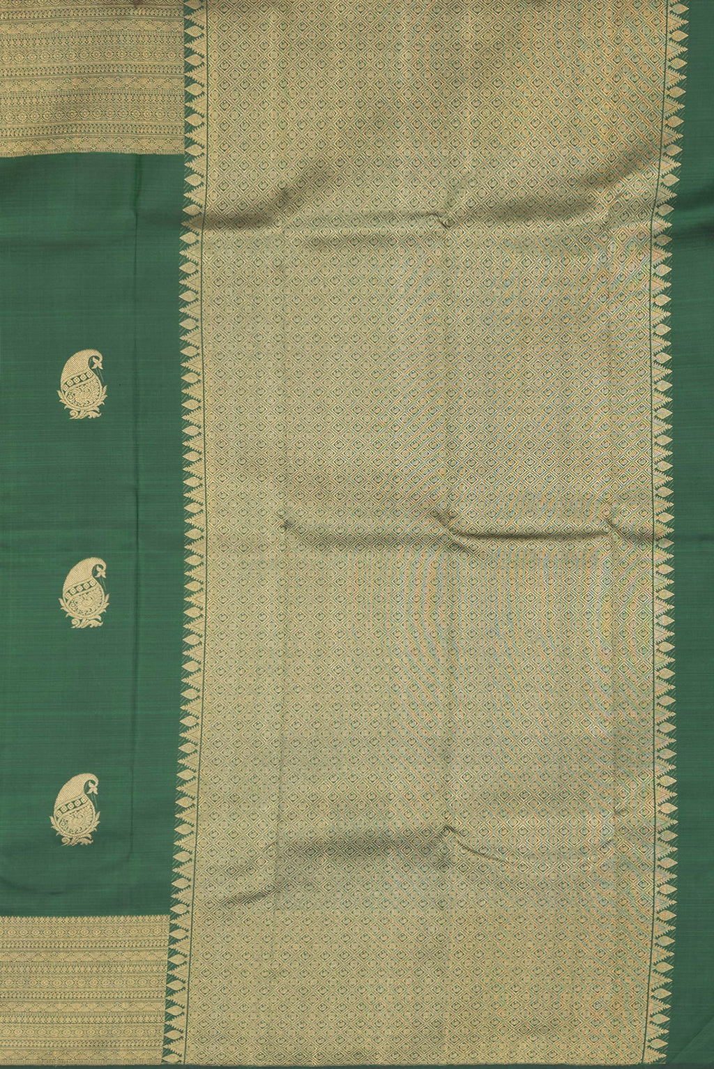 Close up image of the pallu of Bottle Green Dual Tone Kanchipuram Silk Saree with Zari Butta on the body and Zari Border. 