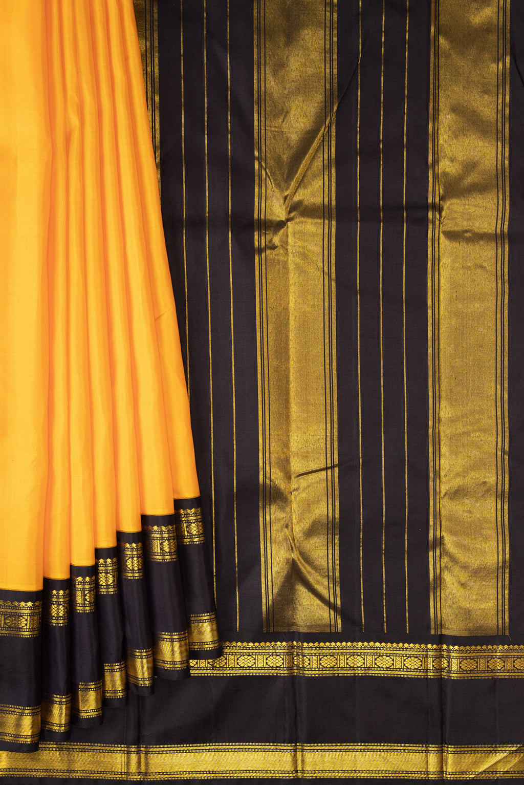 Pleats and pallu of Pure Silk Pure Zari Mustard Dual Tone Kanjivaram Saree with Plain Body and Zari Border. 