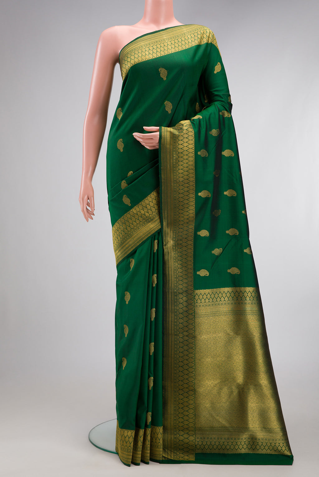 Pure Silk Pure Zari Green Kanjivaram Saree with Zari Butta on the body and Zari Border.  displayed on a mannequin