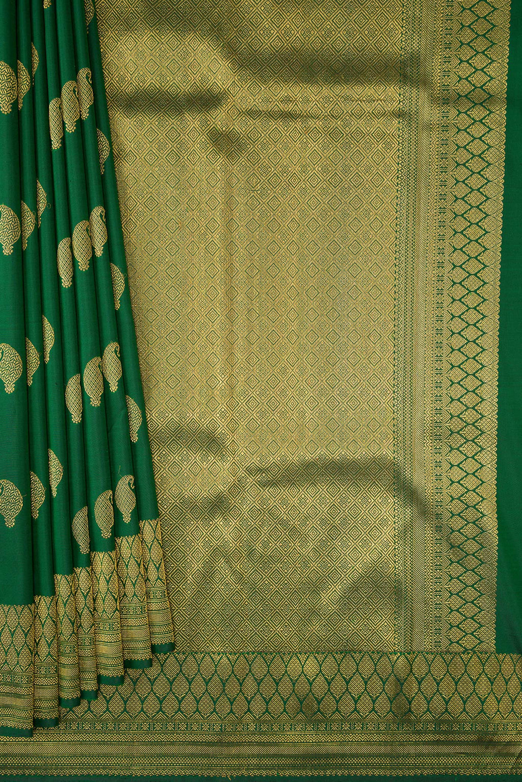 Pleats and pallu of Pure Silk Pure Zari Green Kanjivaram Saree with Zari Butta on the body and Zari Border. 