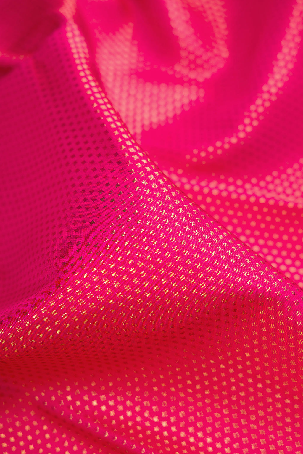 Close up of Pure Silk Pure Zari Pink Dual Tone Kanjivaram Saree with Zari Brocade on the body and Zari Border.  displaying folds