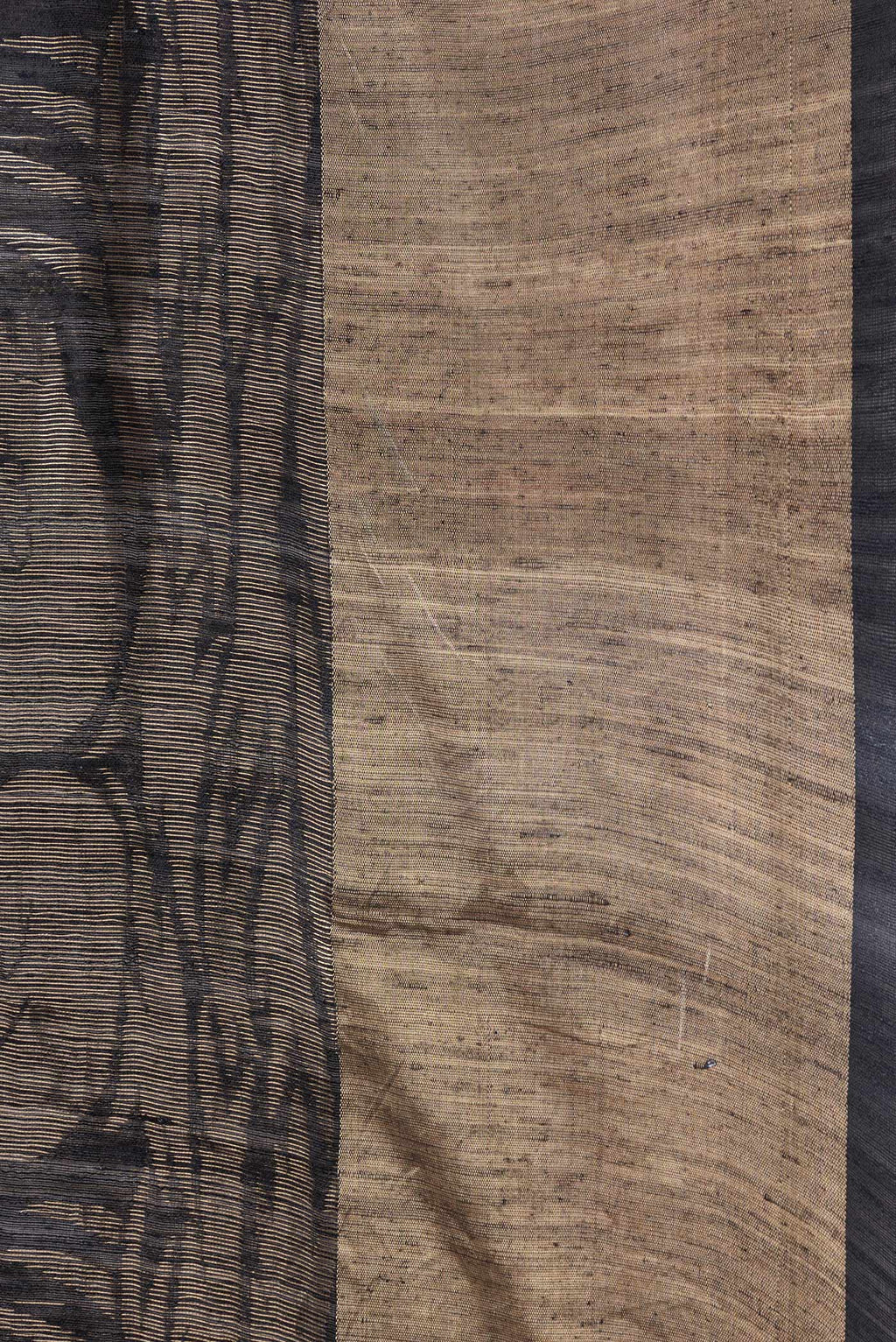 Border image of Black Dual Tone Tussar Silk Saree with Printed design on the body and Zari Border. 