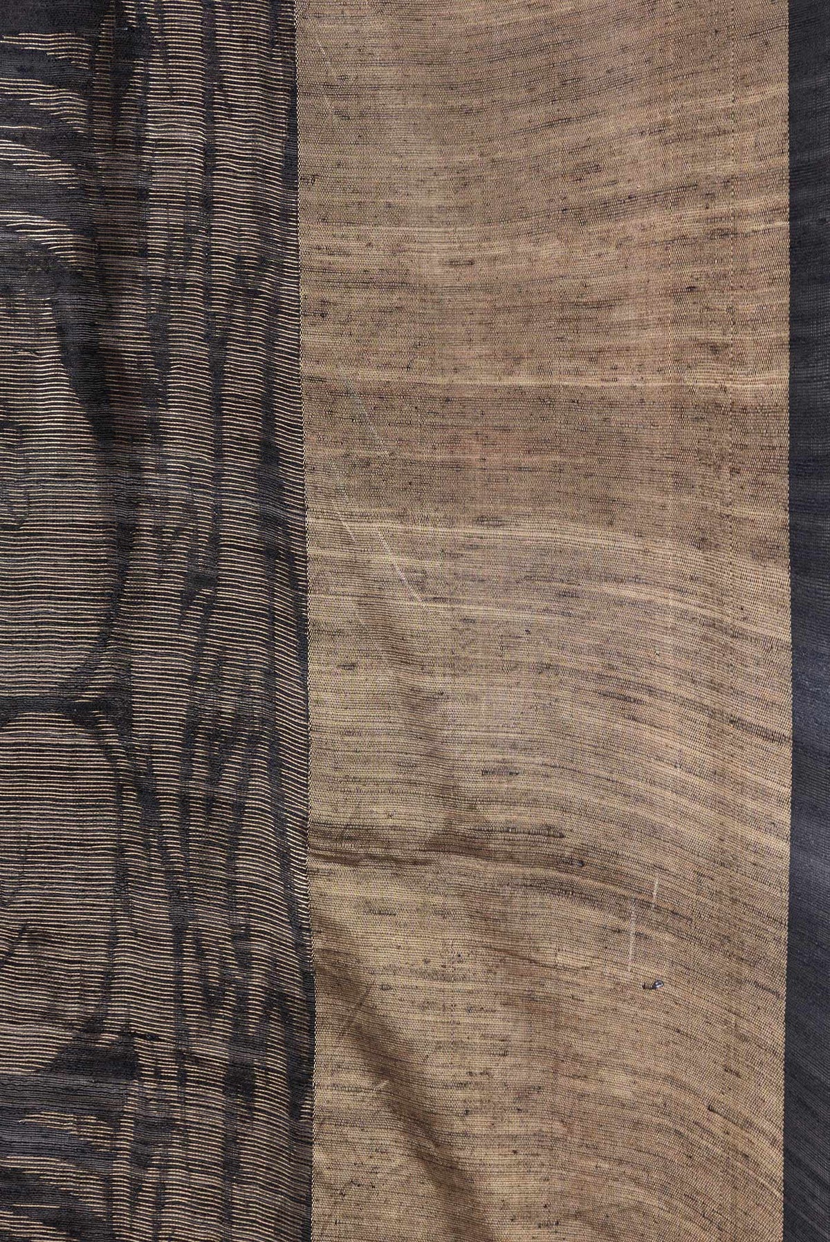 Border image of Black Dual Tone Tussar Silk Saree with Printed design on the body and Zari Border. 