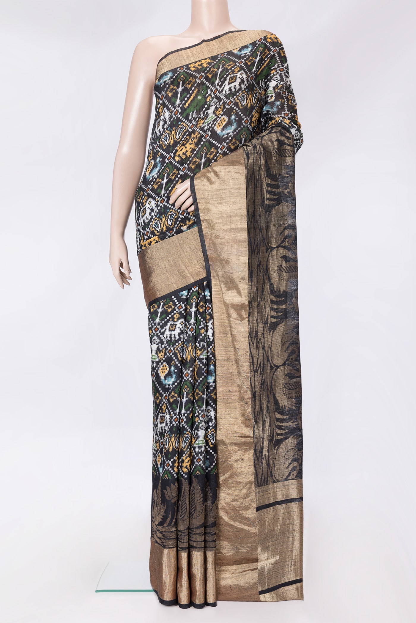 Black Dual Tone Tussar Silk Saree with Printed design on the body and Zari Border.  displayed on a mannequin