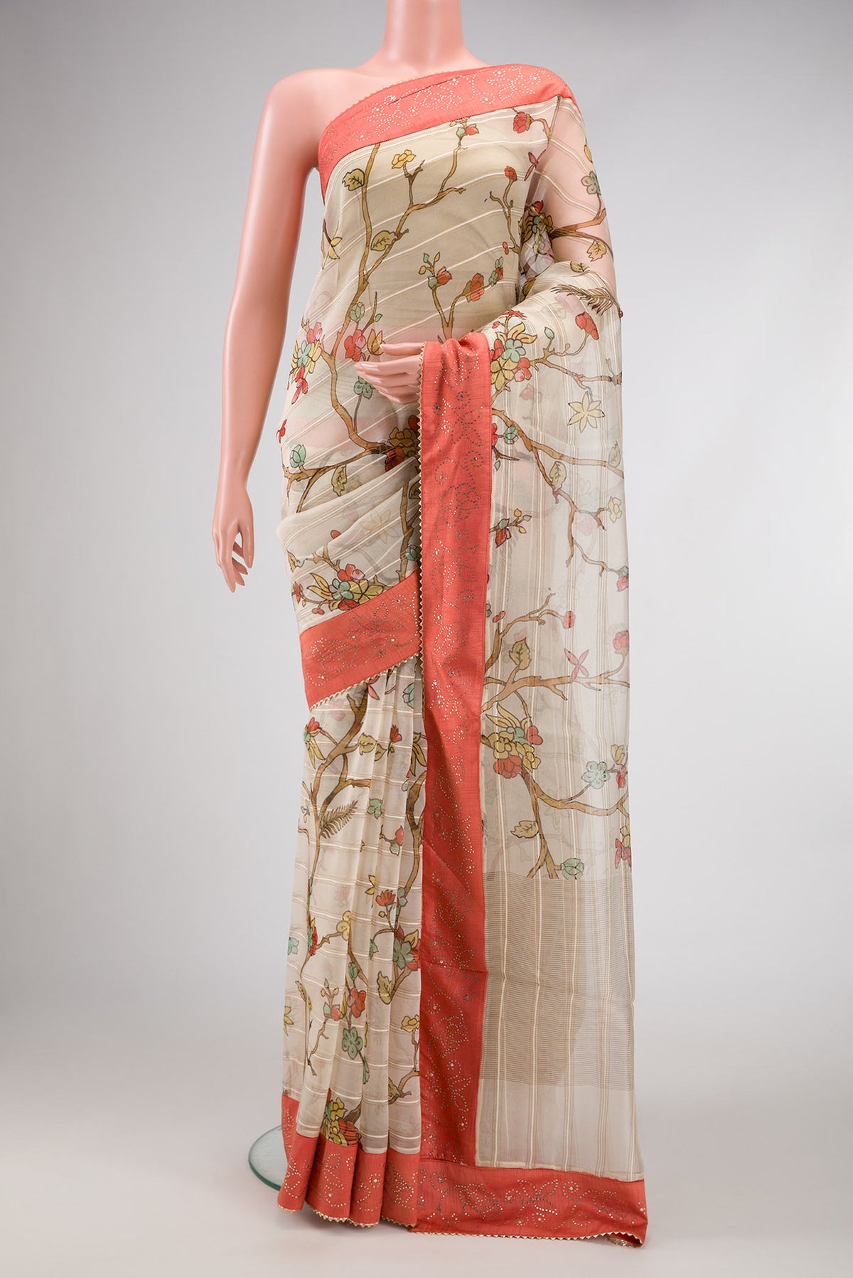 Beige Dual Tone Organza Silk Saree with Printed design on the body and Fancy Border.  displayed on a mannequin