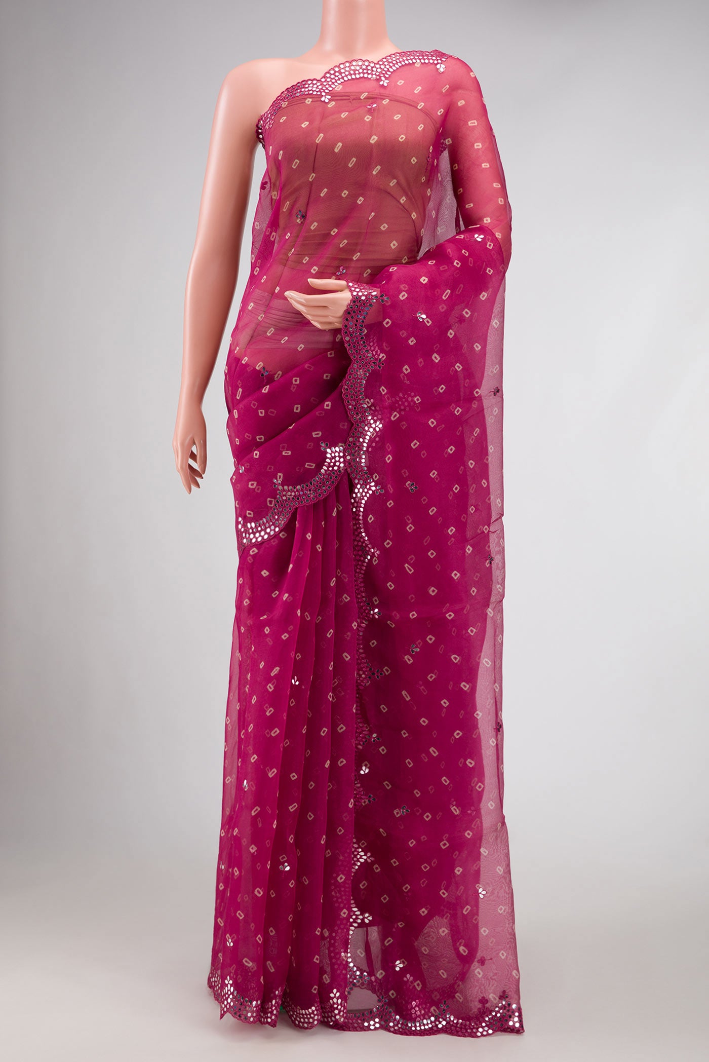 Maroon Dual Tone Organza Silk Saree with Embroidery on the body and Embroidery Border.  displayed on a mannequin