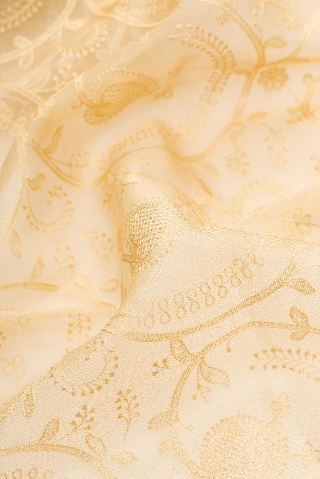 Close up of Sandal Dual Tone Organza Silk Saree with Embroidery on the body and Printed Border.  displaying folds