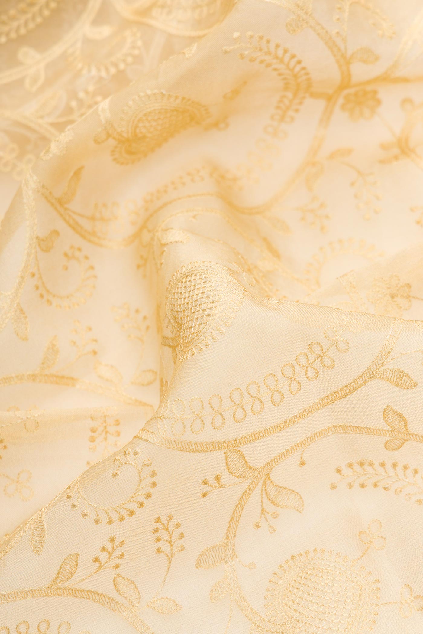Close up of Sandal Dual Tone Organza Silk Saree with Embroidery on the body and Printed Border.  displaying folds