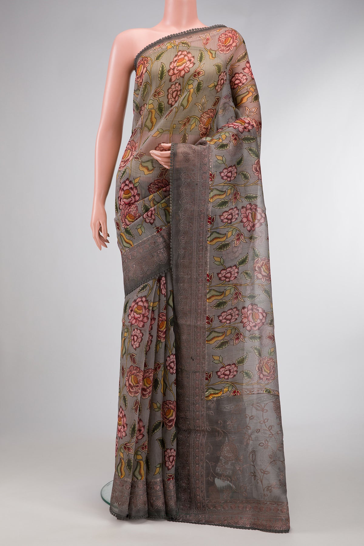 Grey Dual Tone Organza Silk Saree with Printed design on the body and Embroidery Border.  displayed on a mannequin