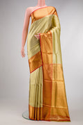 Gold Dual Tone Kanchipuram Tissue Silk Saree with Zari Brocade on the body and Zari Border.  displayed on a mannequin