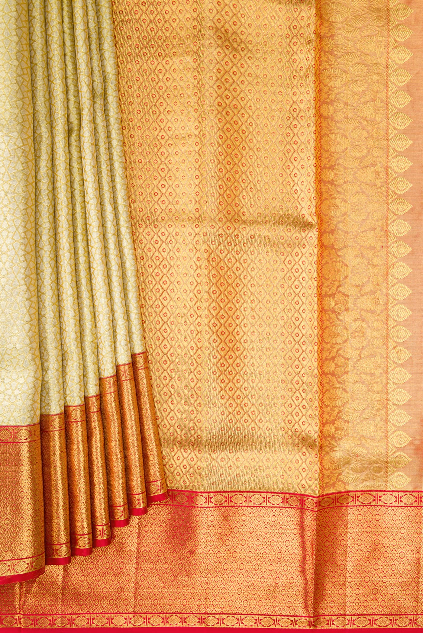 Pleats and pallu of Gold Dual Tone Kanchipuram Tissue Silk Saree with Zari Brocade on the body and Zari Border. 