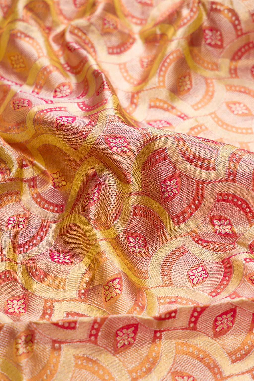 Close up of Gold Dual Tone Kanchipuram Tissue Silk Saree with Zari Brocade on the body and Zari Border.  displaying folds