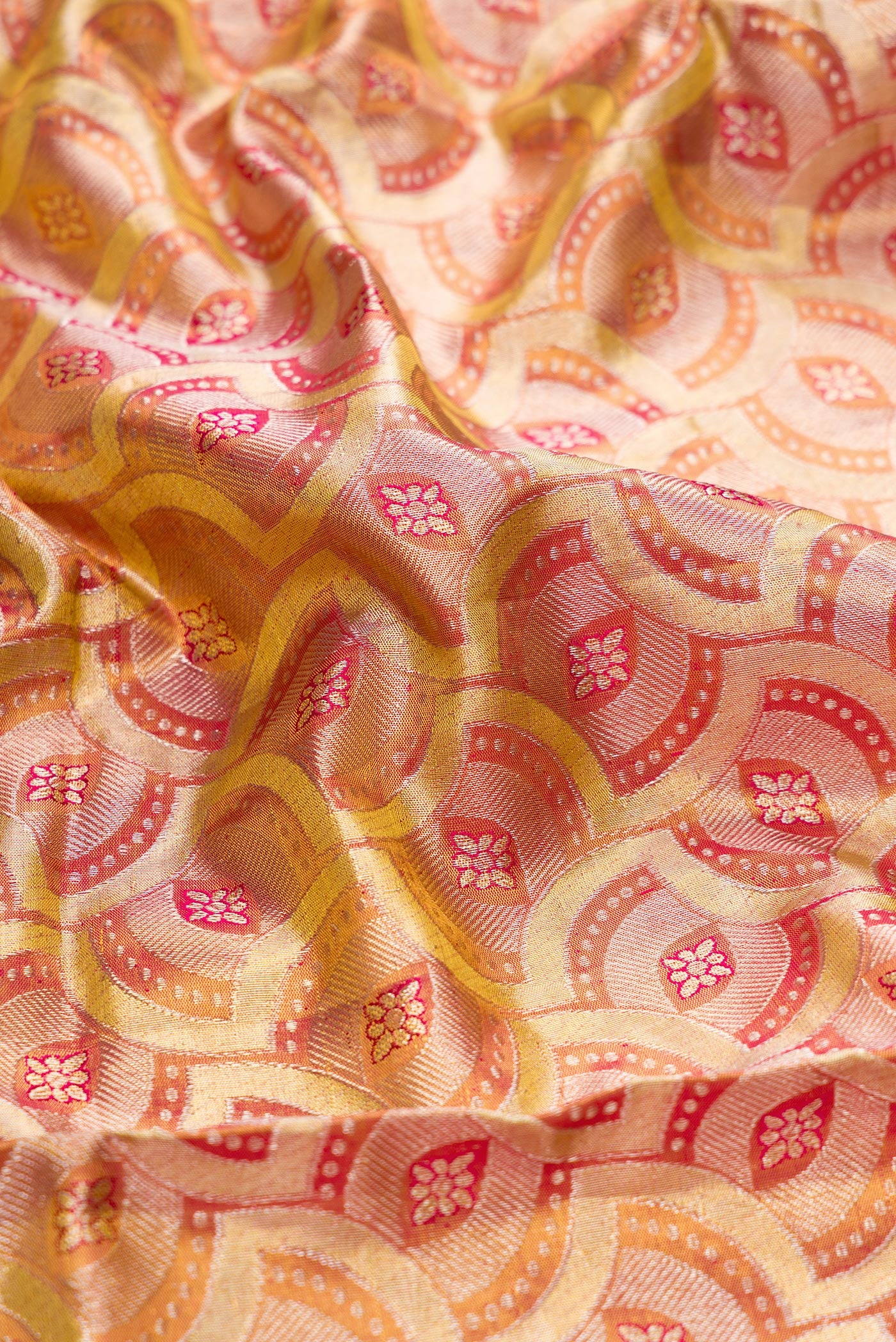 Close up of Gold Dual Tone Kanchipuram Tissue Silk Saree with Zari Brocade on the body and Zari Border.  displaying folds