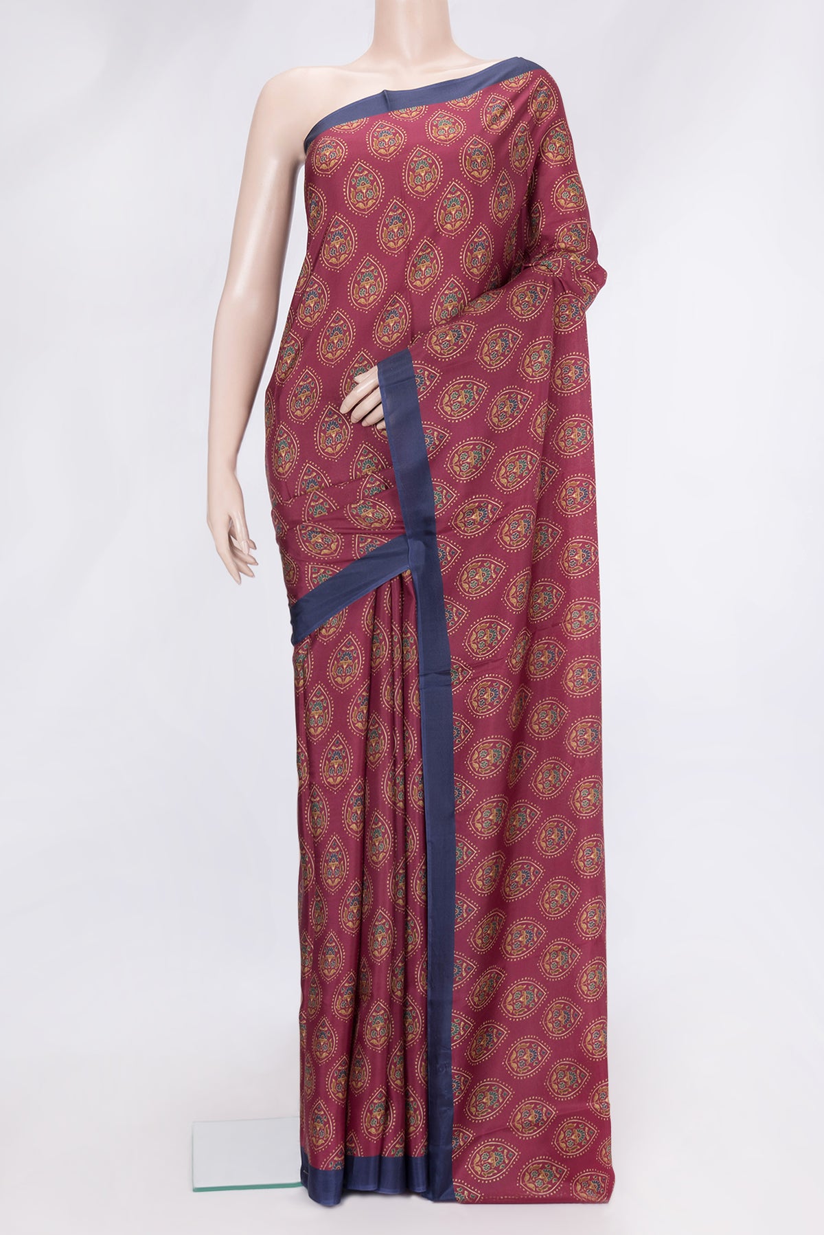 Maroon Dual Tone Printed Silk Saree with Printed design on the body and Plain Border.  displayed on a mannequin