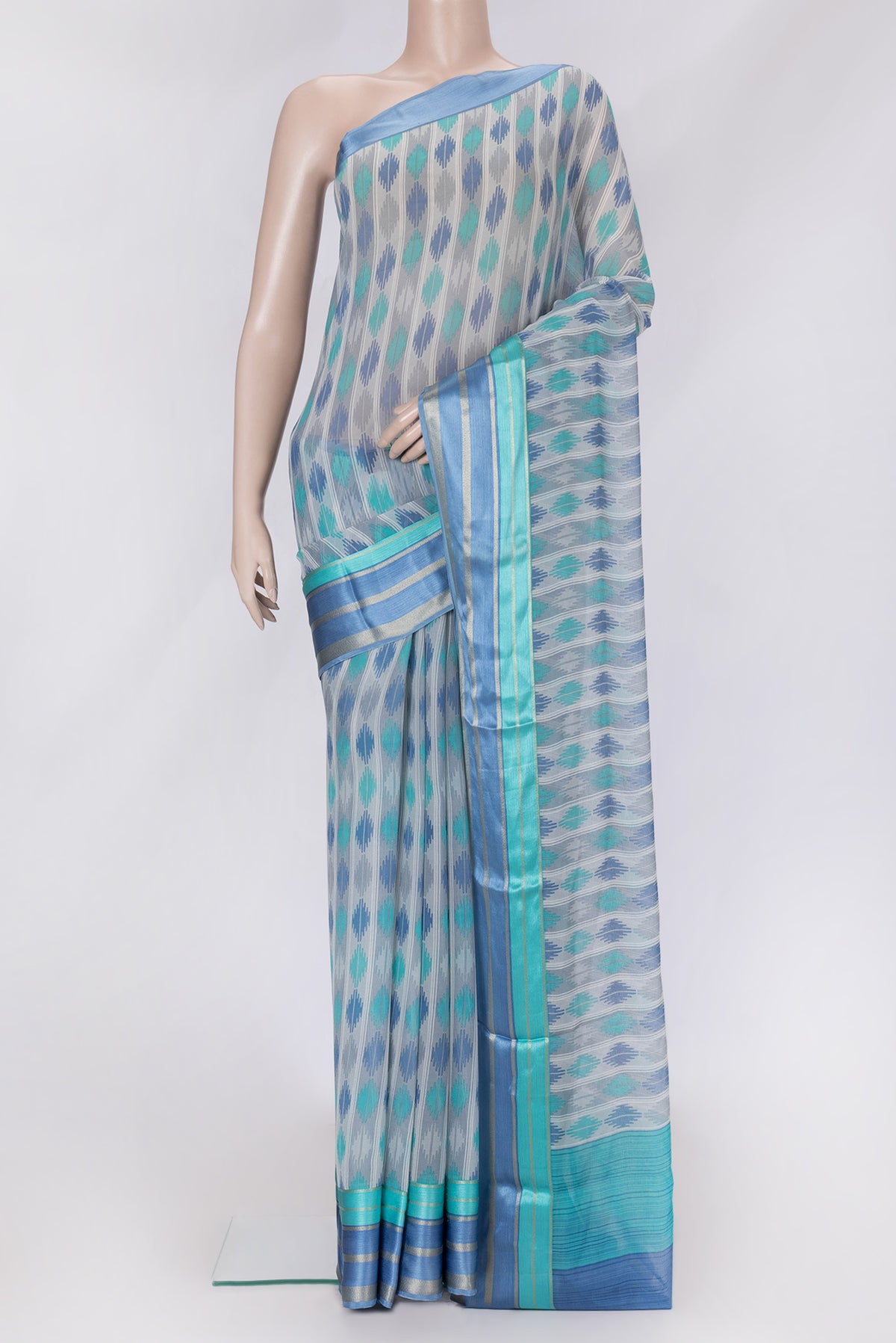 Grey Dual Tone Mysore Chiffon Saree with Printed design on the body and Zari Border.  displayed on a mannequin
