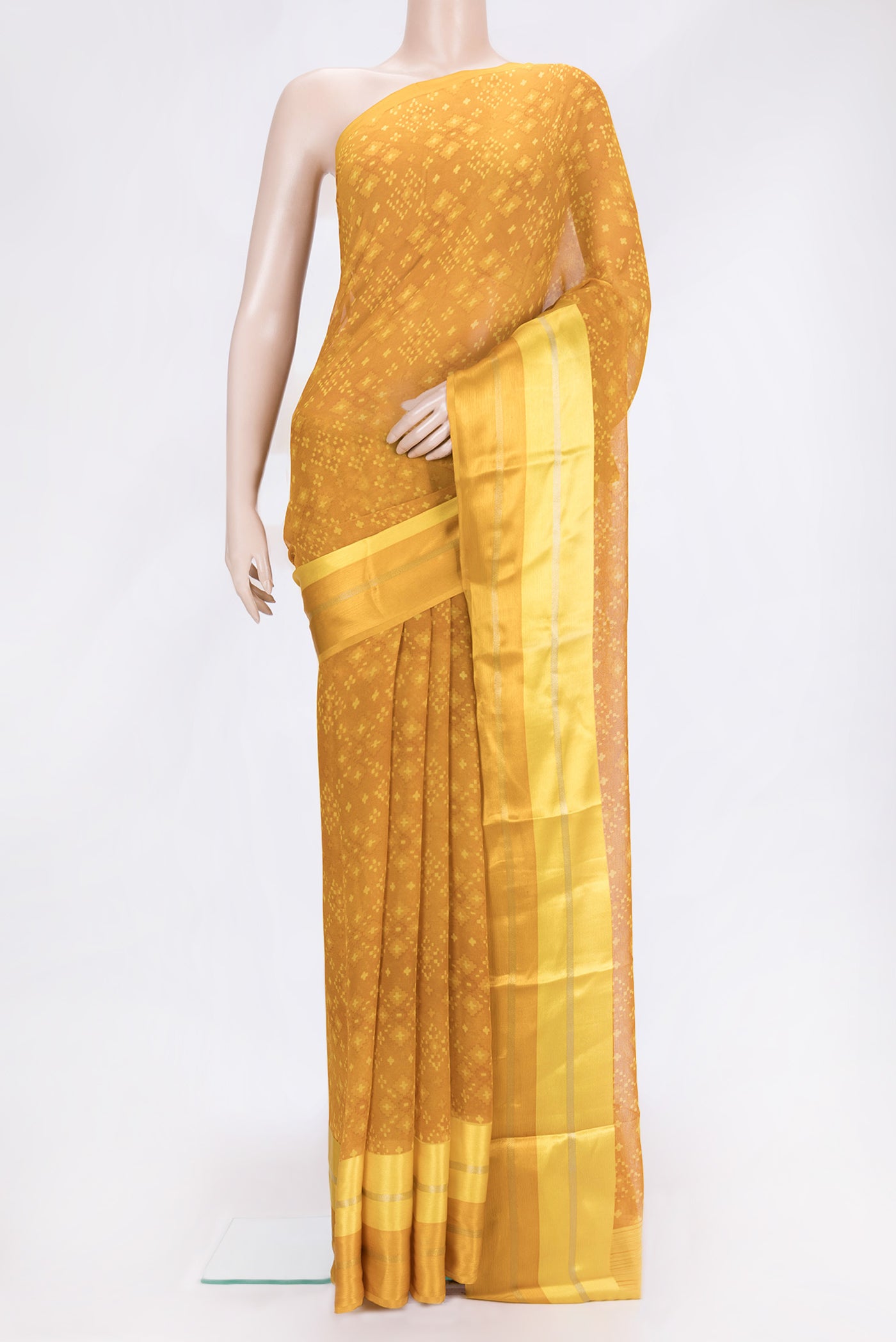 Mustard Dual Tone Mysore Chiffon Saree with Printed design on the body and Plain Border.  displayed on a mannequin