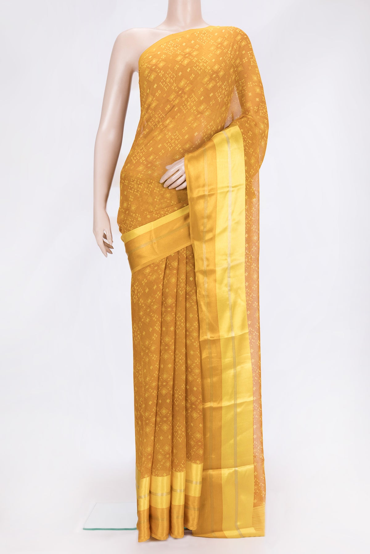 Mustard Dual Tone Mysore Chiffon Saree with Printed design on the body and Plain Border.  displayed on a mannequin
