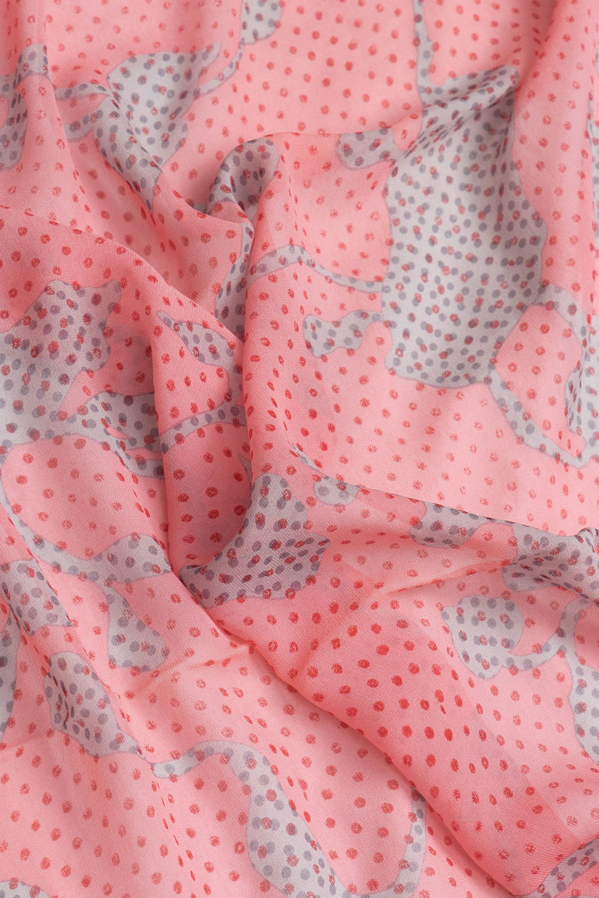 Close up of Pink Dual Tone Mysore Georgette Saree with Printed design on the body and Zari Border.  displaying folds