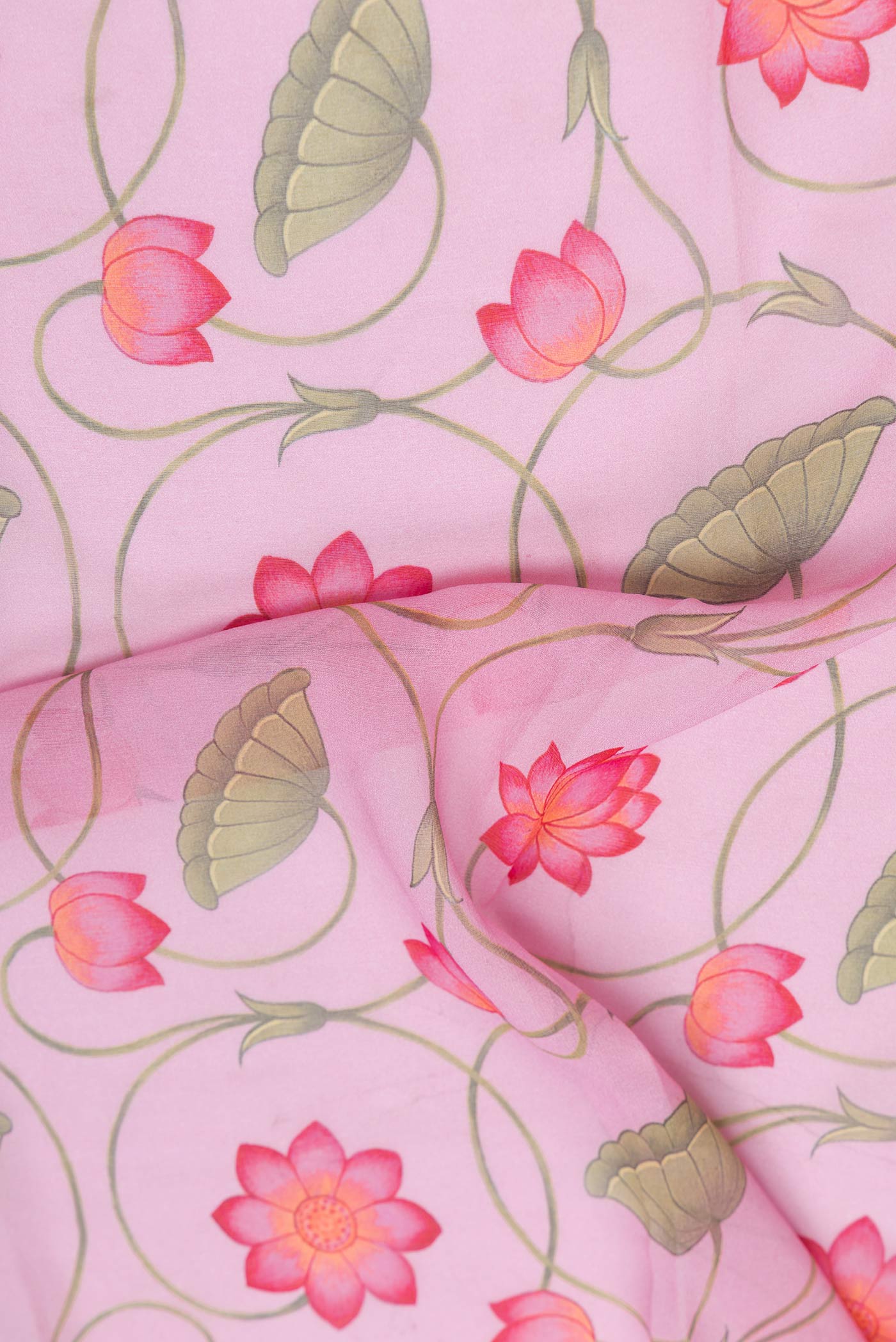 Close up of Pink Dual Tone Mysore Georgette SareePrinted design on the body and Zari Border displaying folds