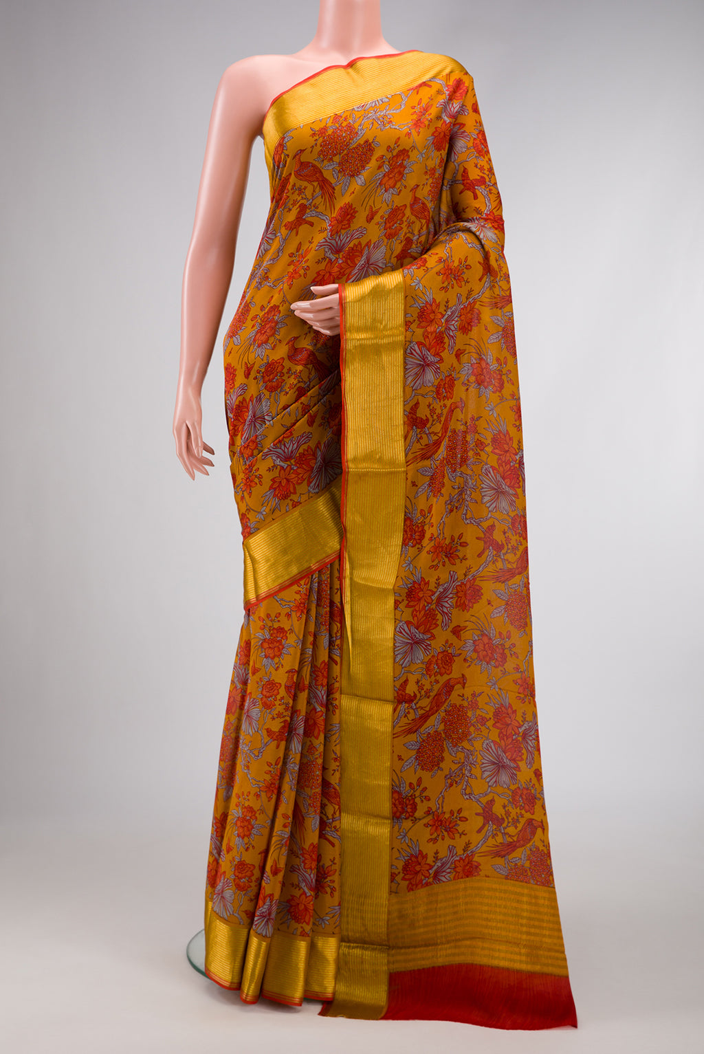 Mustard Dual Tone Mysore Crepe Saree with Printed design on the body and Zari Border.  displayed on a mannequin