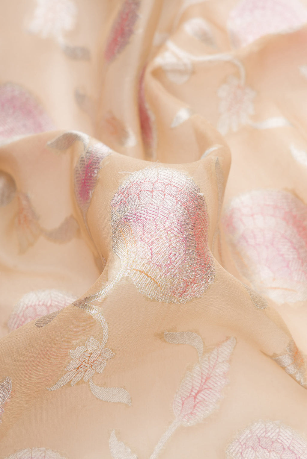 Close up of Sandal Dual Tone Organza Silk Saree with Zari Brocade on the body and Zari Border.  displaying folds