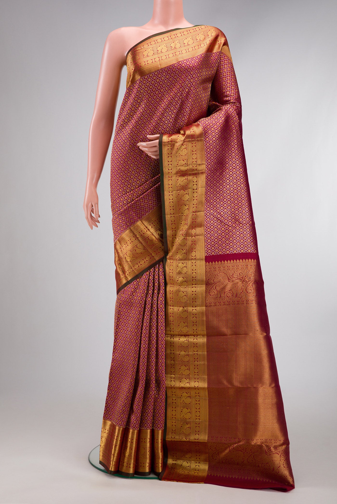Maroon Dual Tone Kanchipuram Silk Saree with Zari Brocade on the body and Zari Border.  displayed on a mannequin