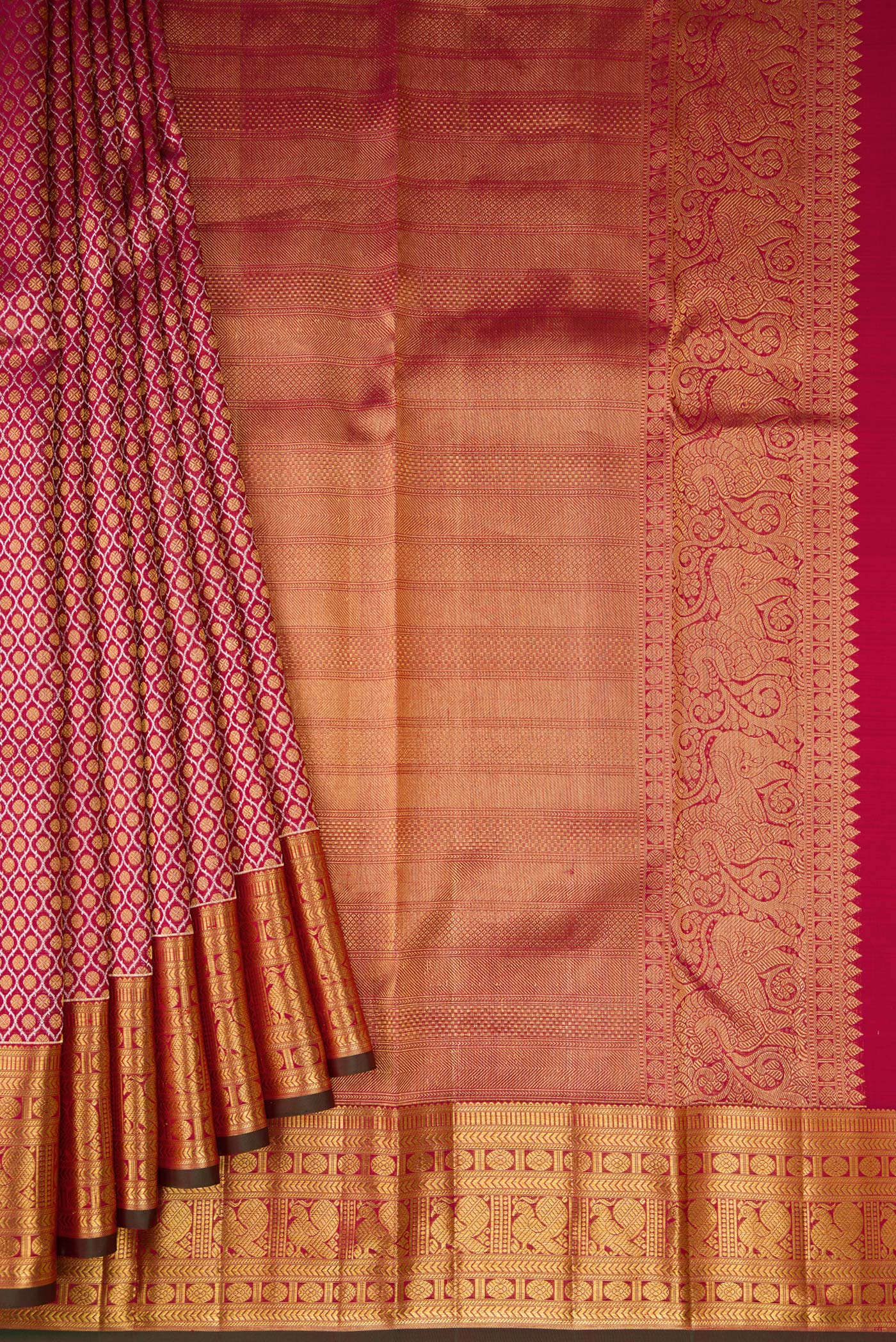 Pleats and pallu of Maroon Dual Tone Kanchipuram Silk Saree with Zari Brocade on the body and Zari Border. 