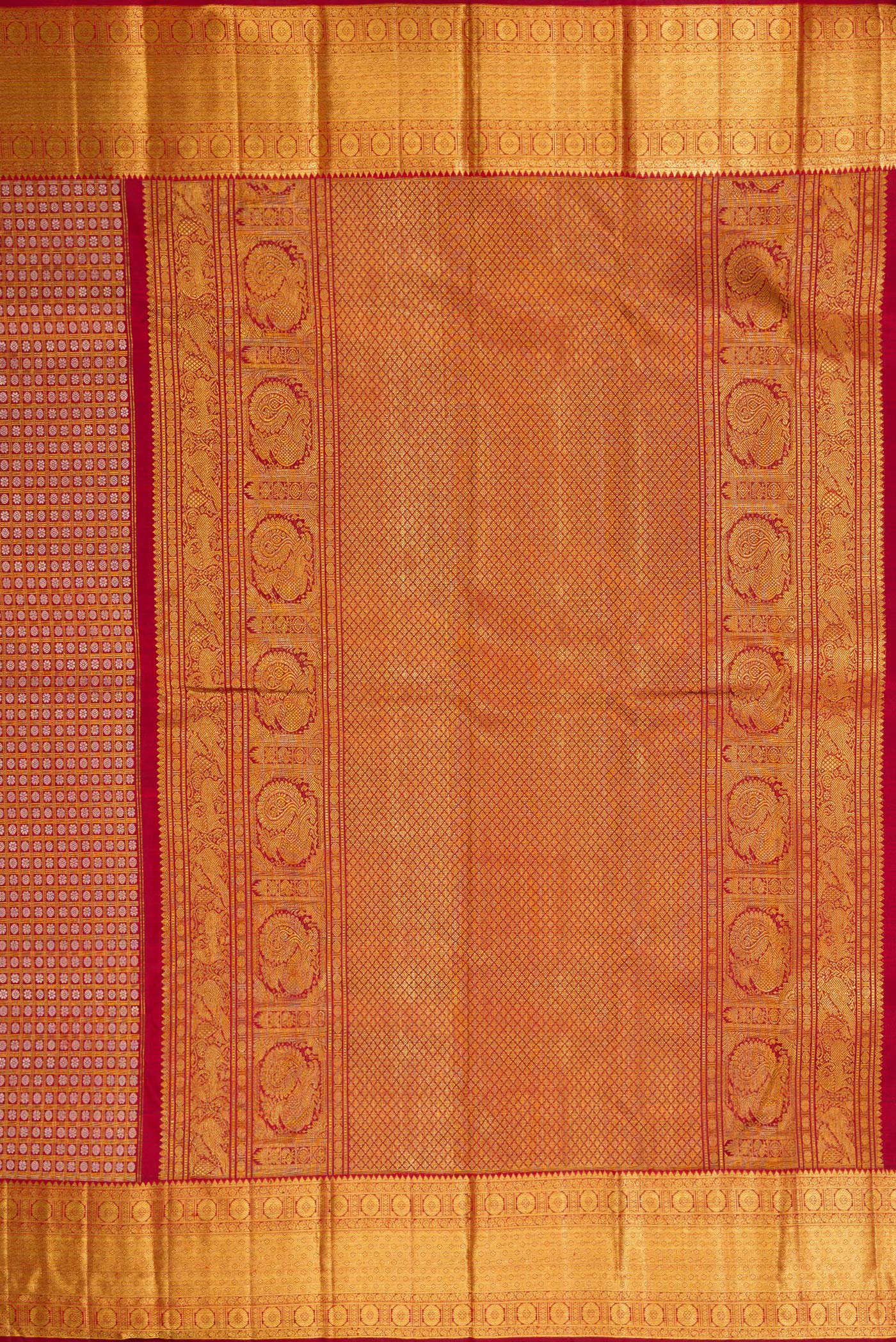 Close up image of the pallu of Maroon Kanchipuram Silk Saree with Zari Brocade on the body and Zari Border. 