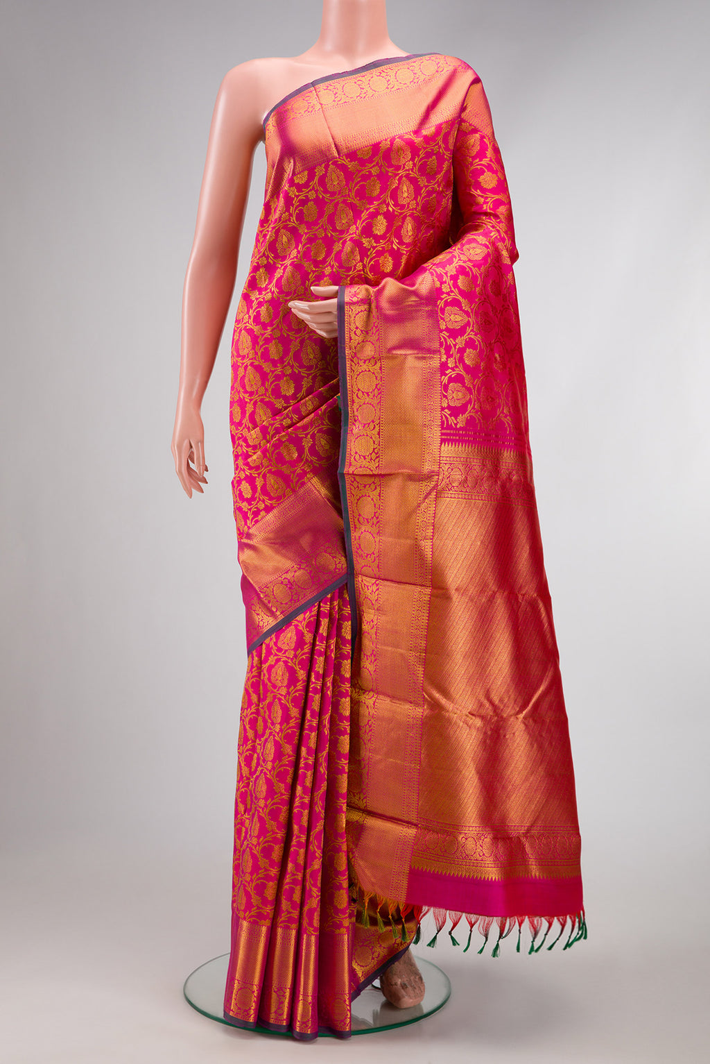 Pink Dual Tone Kanjivaram Silk Saree with Zari Brocade on the body and Zari Border.  displayed on a mannequin