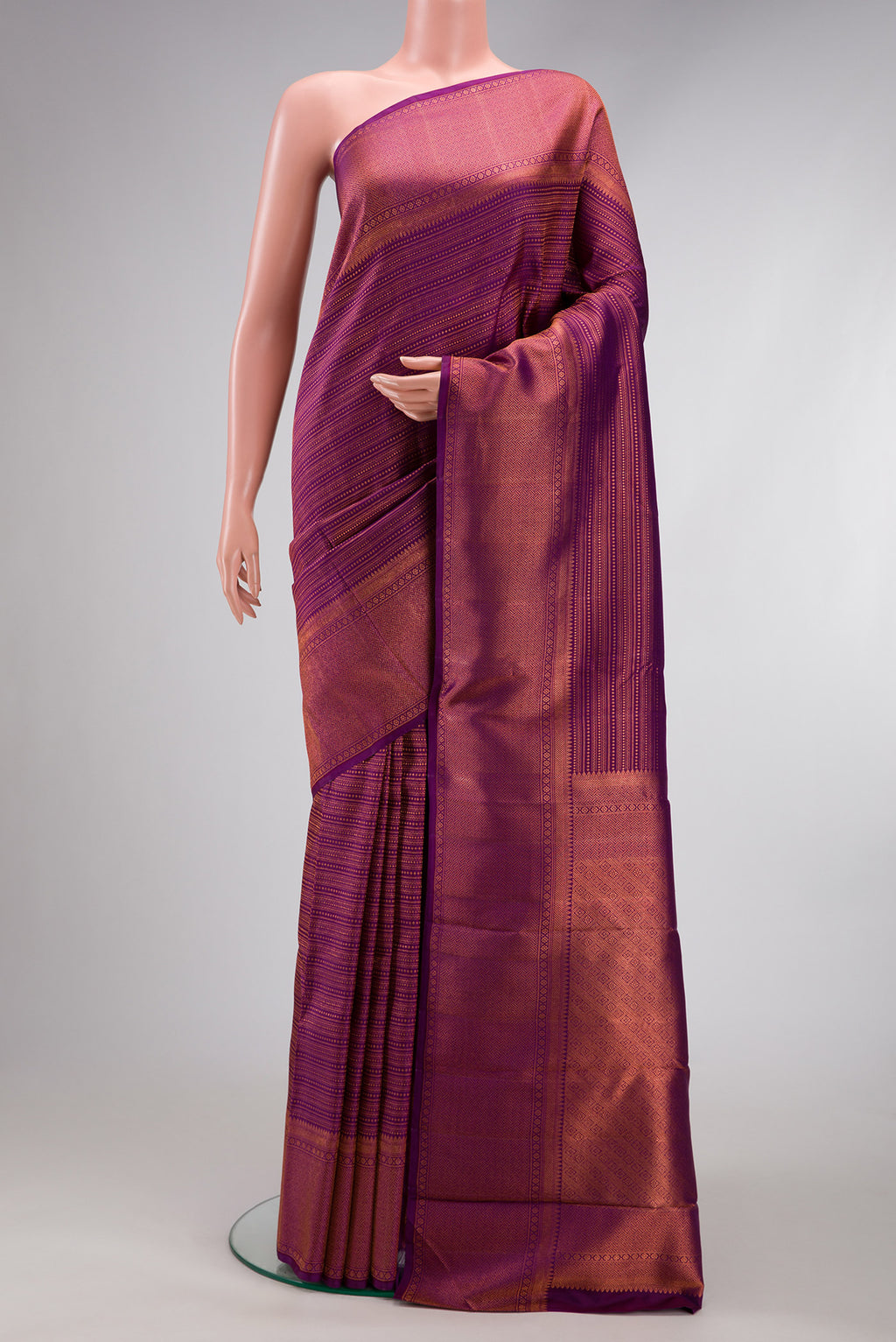 Purple Dual Tone Kanjivaram Silk Saree with Zari Brocade on the body and Fancy Border.  displayed on a mannequin