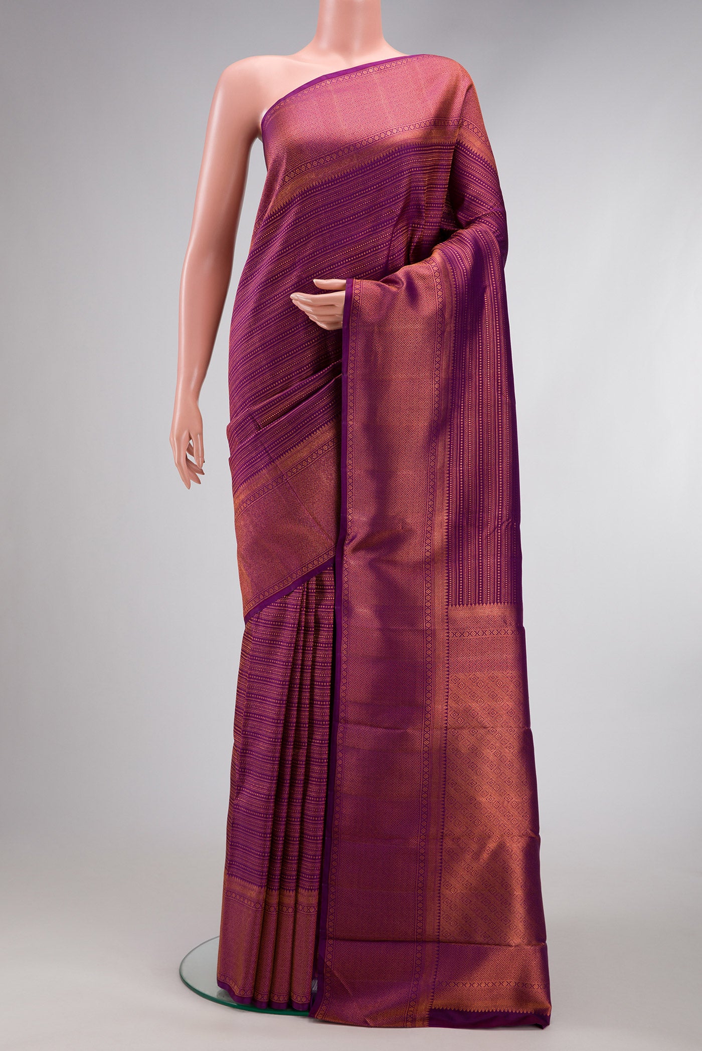 Purple Dual Tone Kanjivaram Silk Saree with Zari Brocade on the body and Fancy Border.  displayed on a mannequin