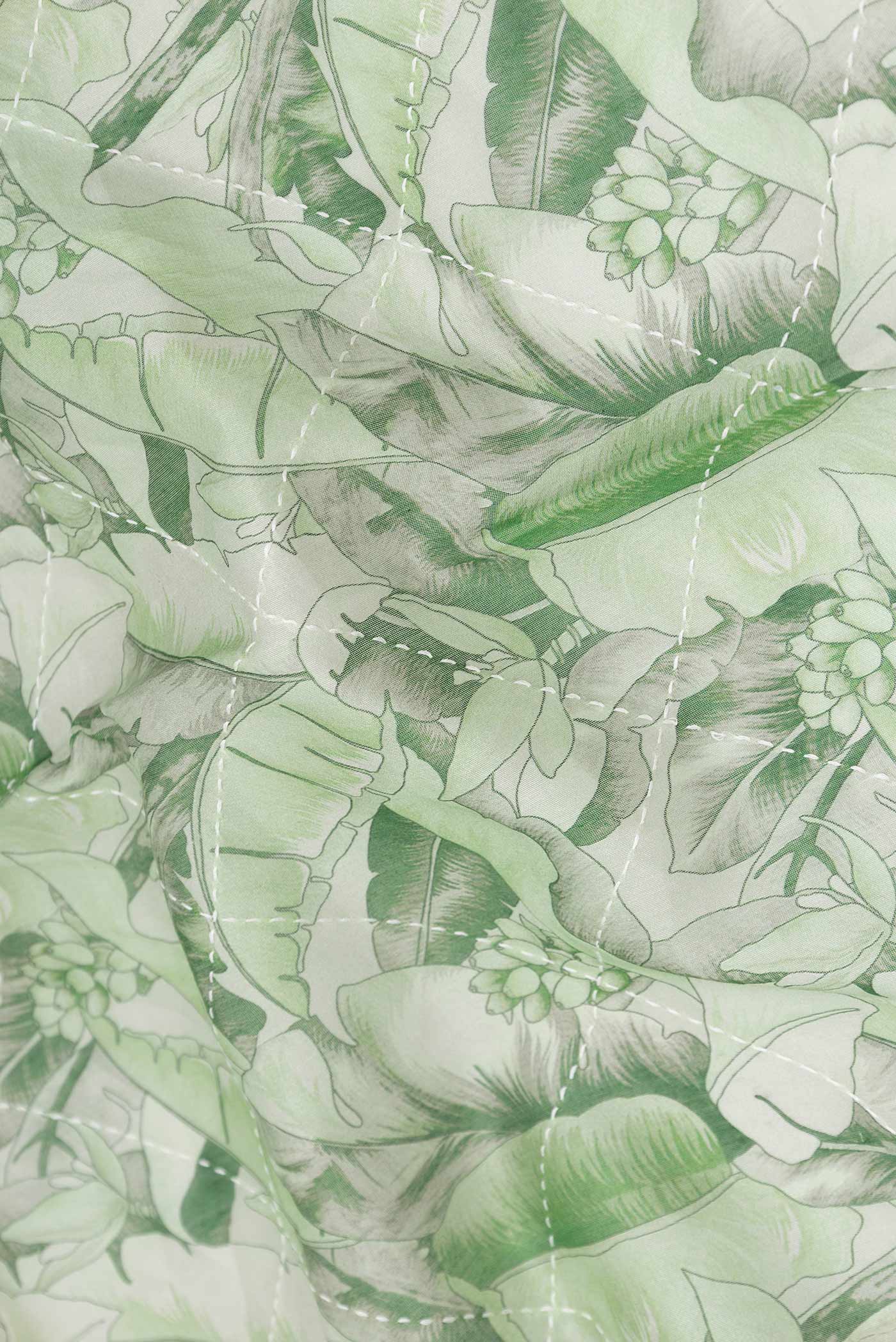 Close up of Green Dual Tone Chanderi Silk Saree with Printed design on the body and Zari Border displaying folds