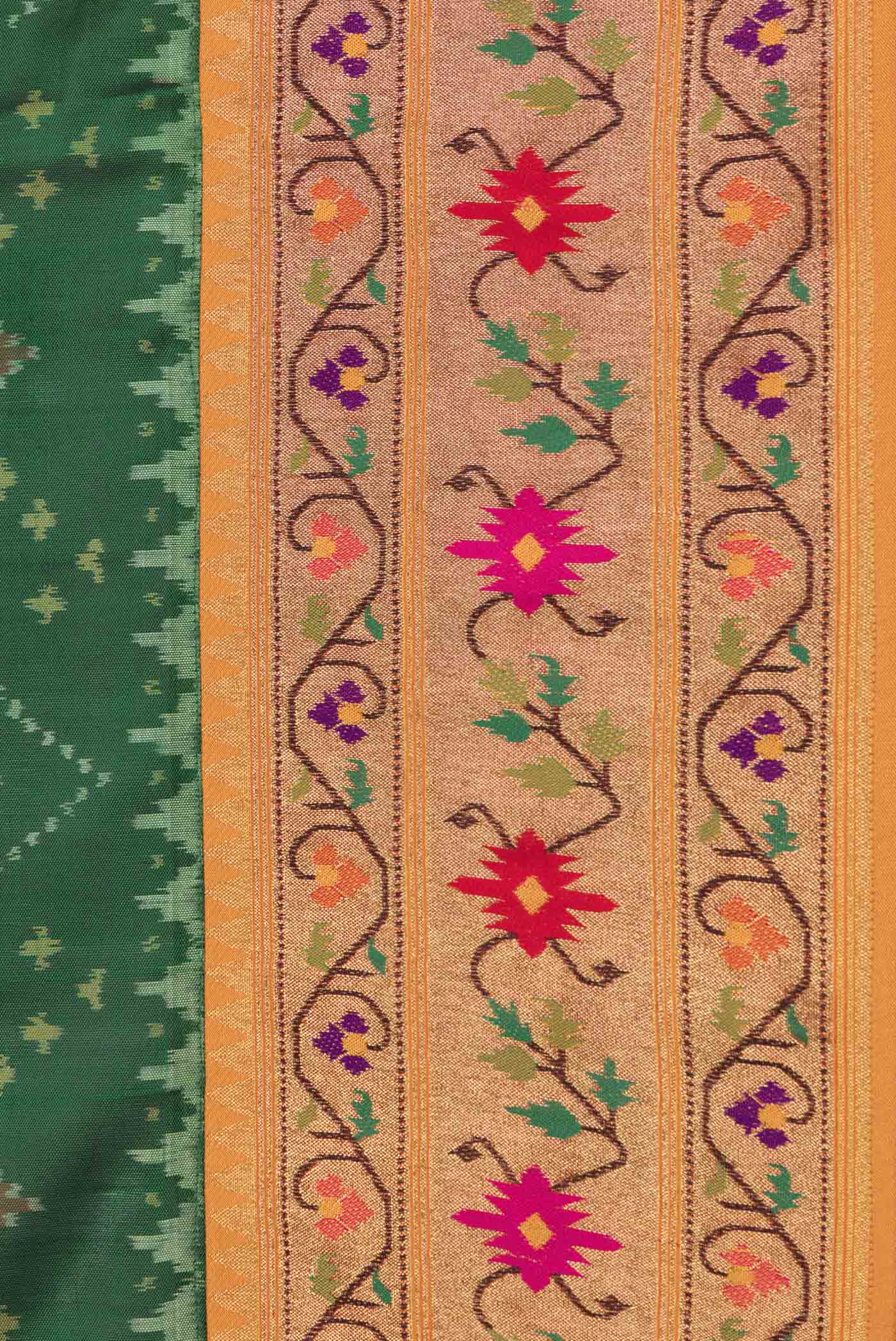 Border image of Green Dual Tone Double Ikat Saree with Ikat Print on the body and Zari And Thread Border. 