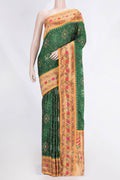 Green Dual Tone Double Ikat Saree with Ikat Print on the body and Zari And Thread Border.  displayed on a mannequin