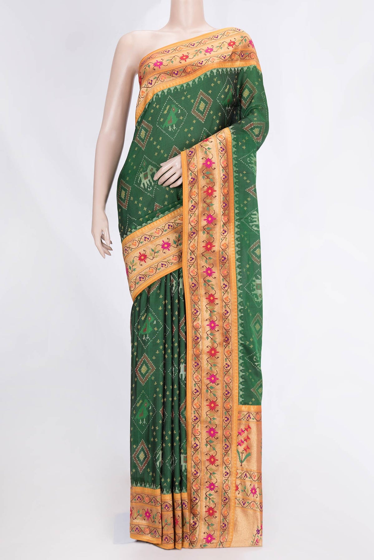 Green Dual Tone Double Ikat Saree with Ikat Print on the body and Zari And Thread Border.  displayed on a mannequin