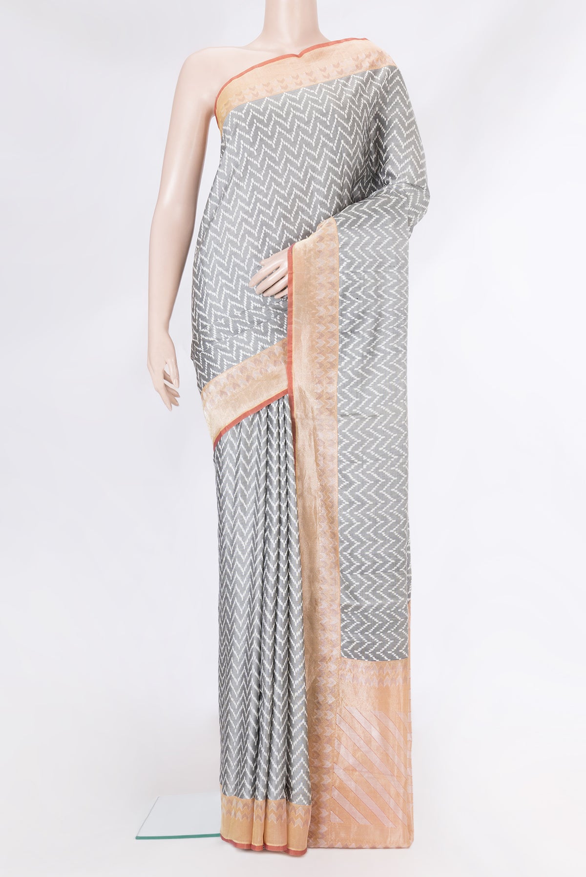 Grey Dual Tone Double Ikat Saree with Ikat Print on the body and Zari Border.  displayed on a mannequin