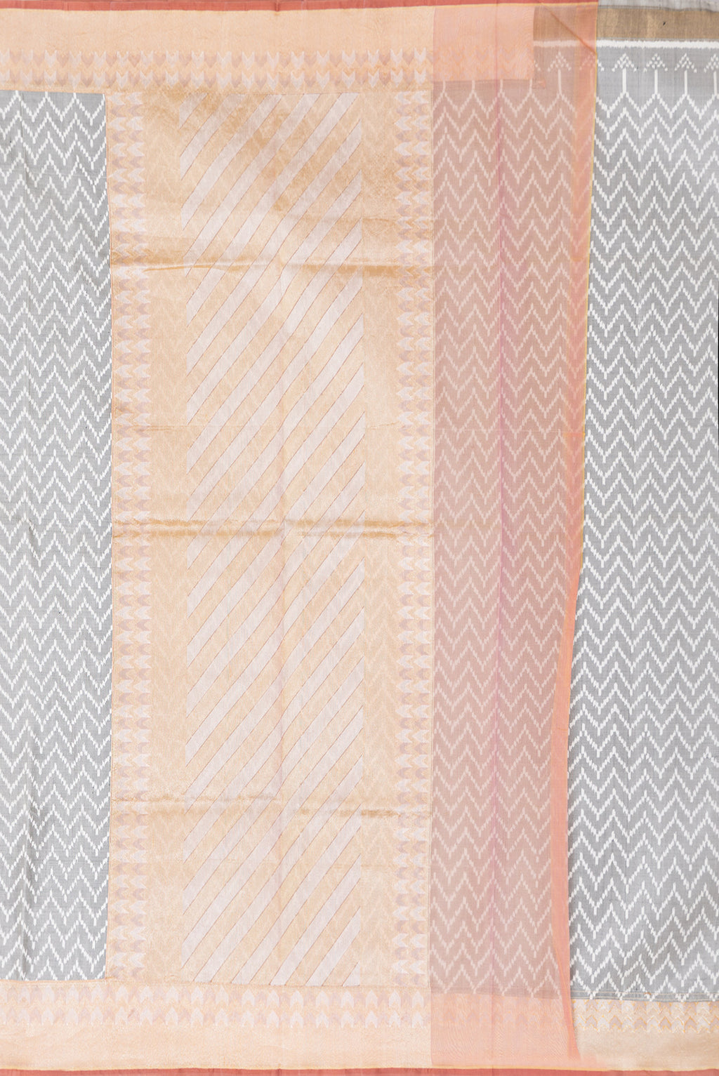 Close up image of the pallu of Grey Dual Tone Double Ikat Saree with Ikat Print on the body and Zari Border. 