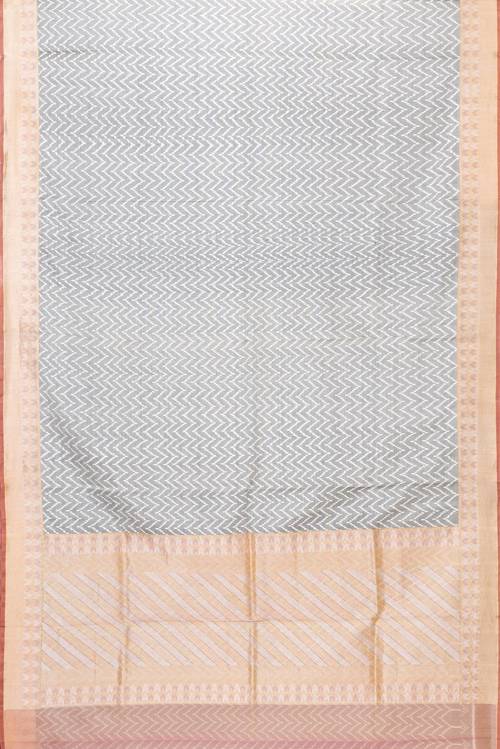 Flat view of Grey Dual Tone Double Ikat Saree with Ikat Print on the body and Zari Border. 