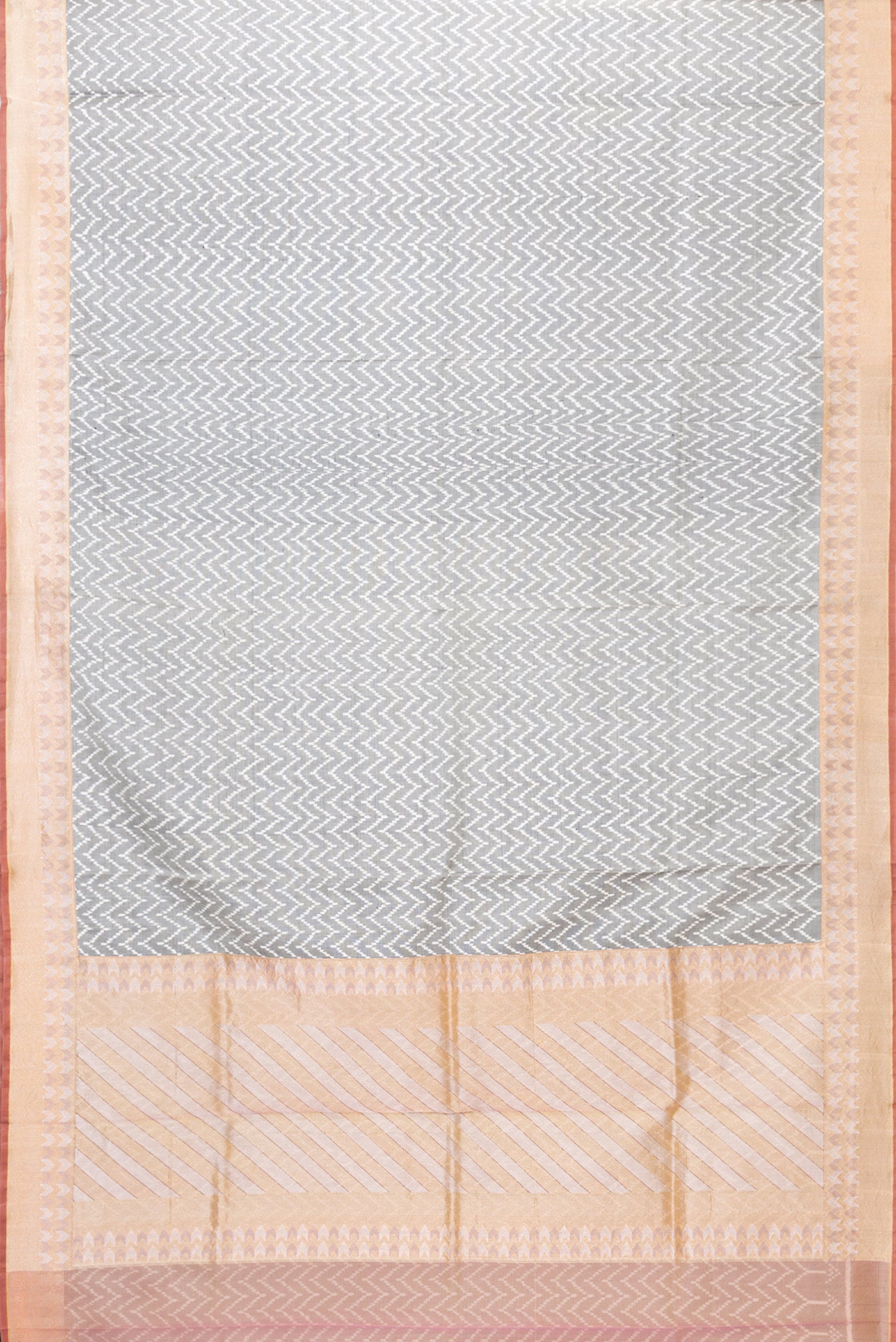 Flat view of Grey Dual Tone Double Ikat Saree with Ikat Print on the body and Zari Border. 