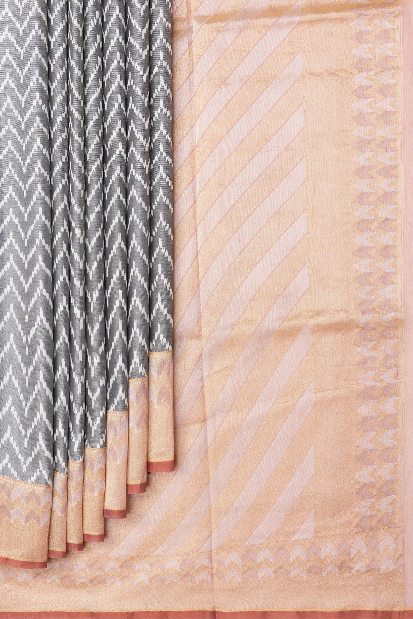 Pleats and pallu of Grey Dual Tone Double Ikat Saree with Ikat Print on the body and Zari Border. 