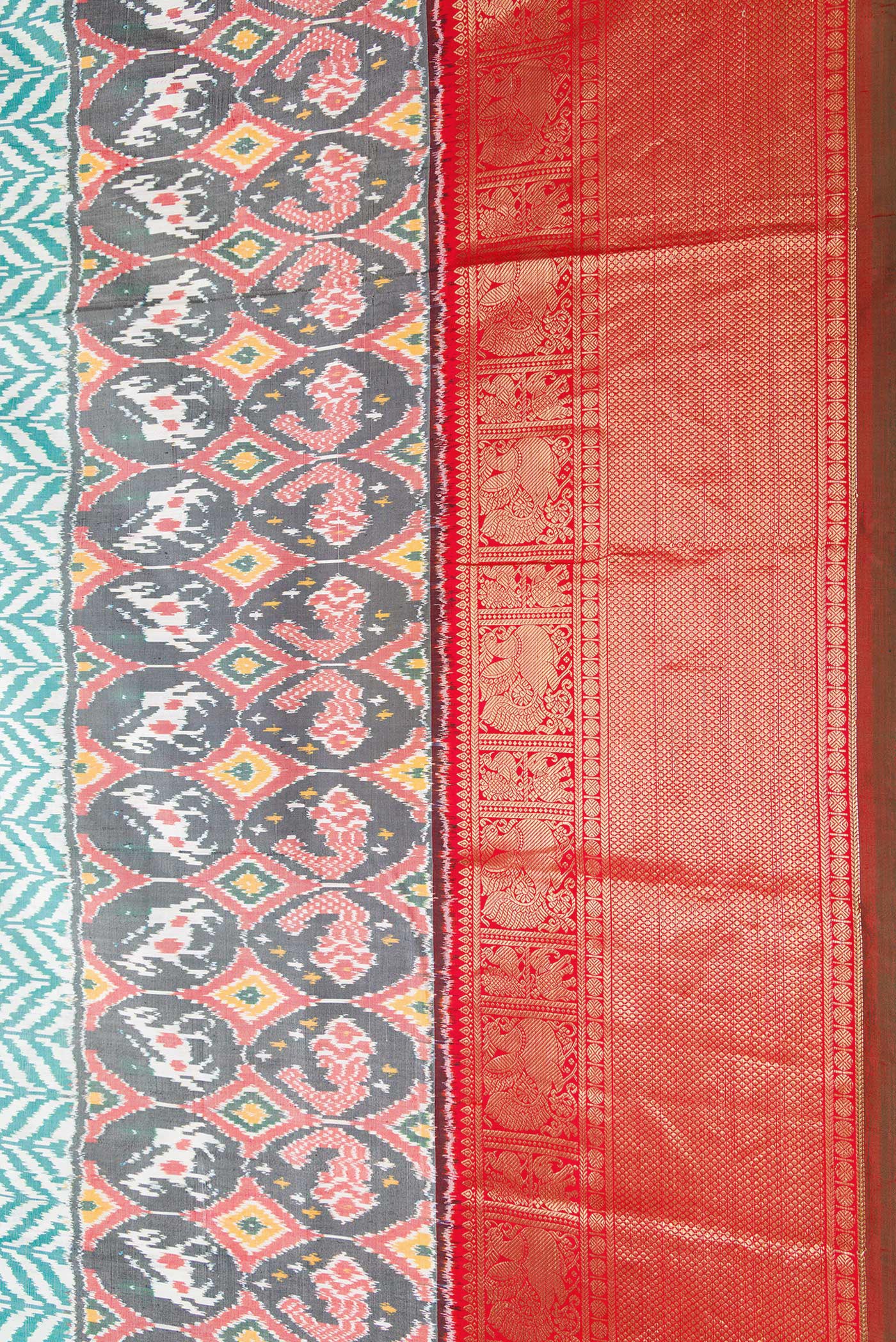 Border image of Off White and Green Color Double Ikat Saree with Ikat Print on the body and Ikat Border. 