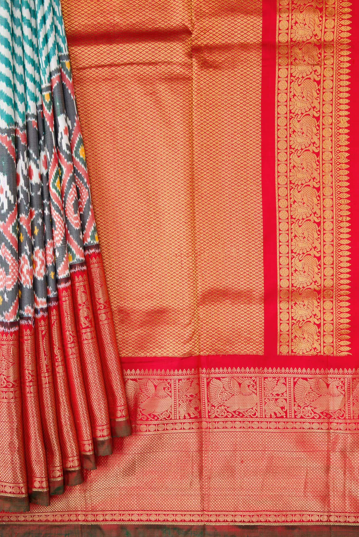 Pleats and pallu of Off White and Green Color Double Ikat Saree with Ikat Print on the body and Ikat Border. 