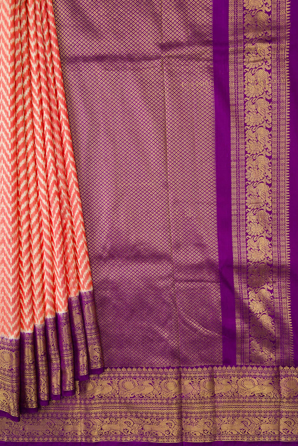 Pleats and pallu of Orange Dual Tone Double Ikat Saree with Ikat Print on the body and Ikat Border. 