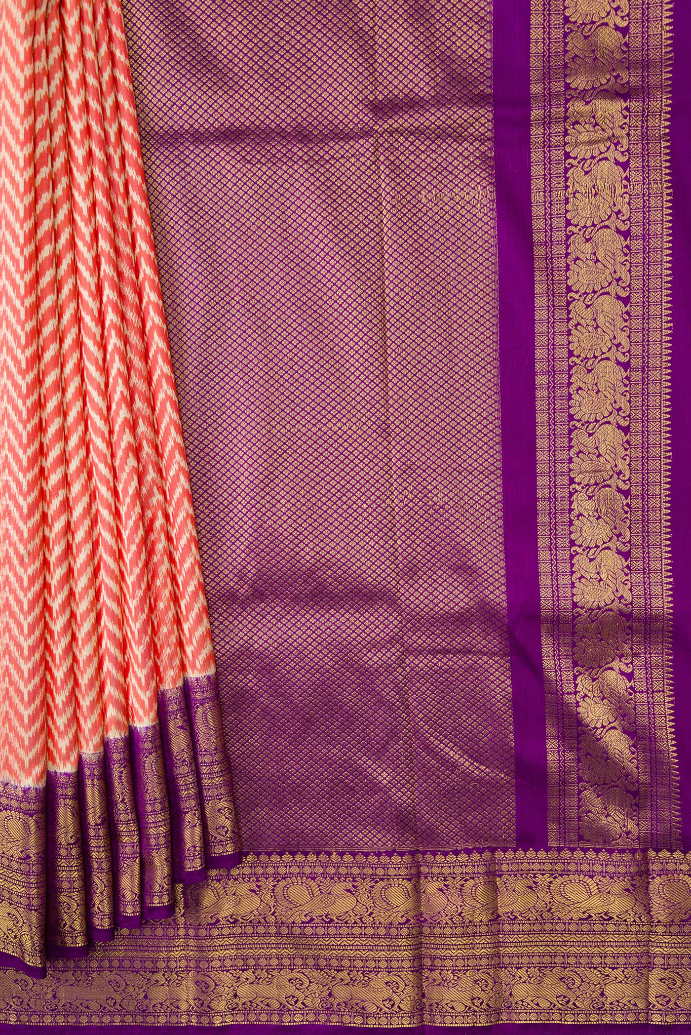 Pleats and pallu of Orange Dual Tone Double Ikat Saree with Ikat Print on the body and Ikat Border. 