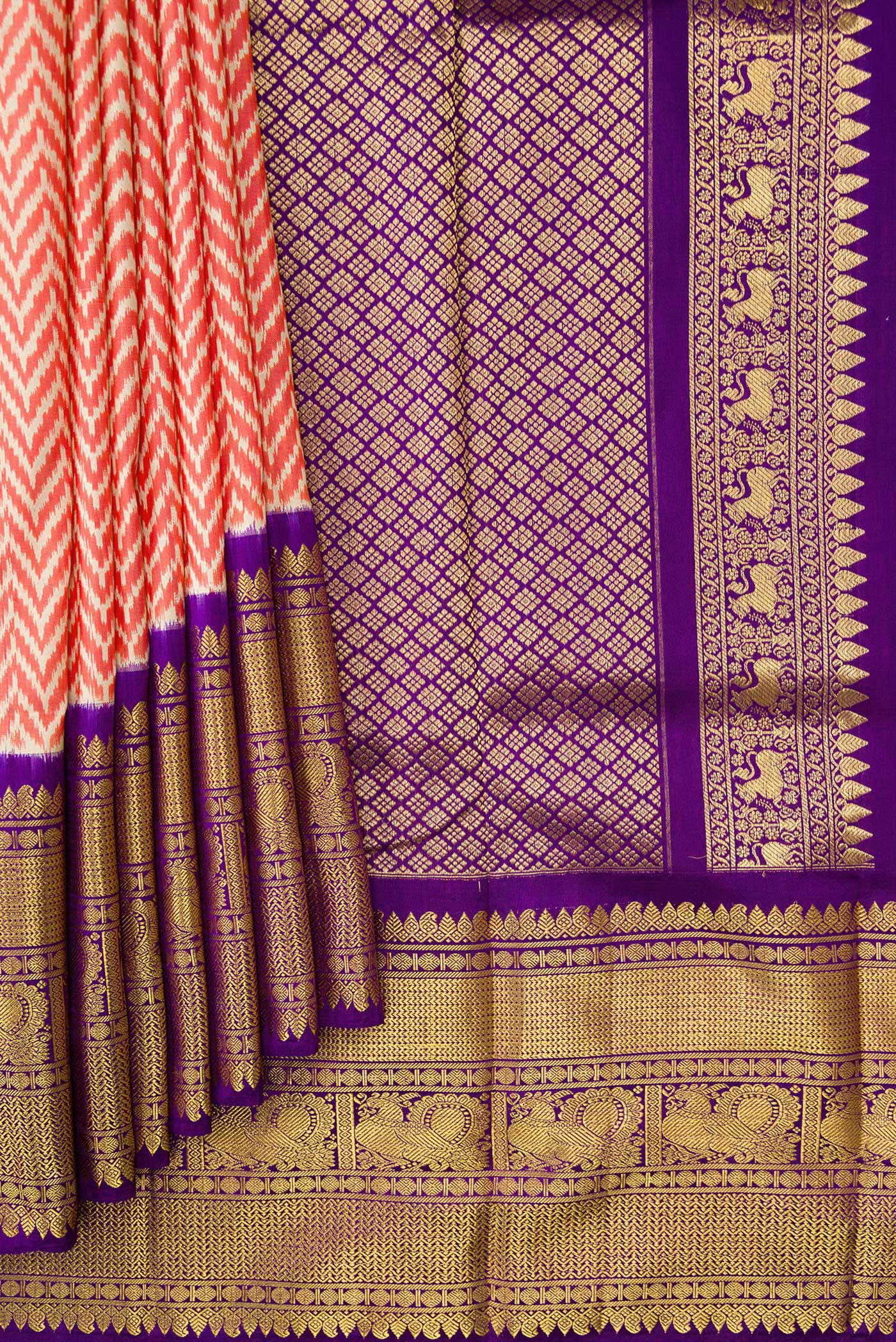 Pleats and pallu of Off White and Orange Color Double Ikat Saree with Ikat Print on the body and Zari Border. 