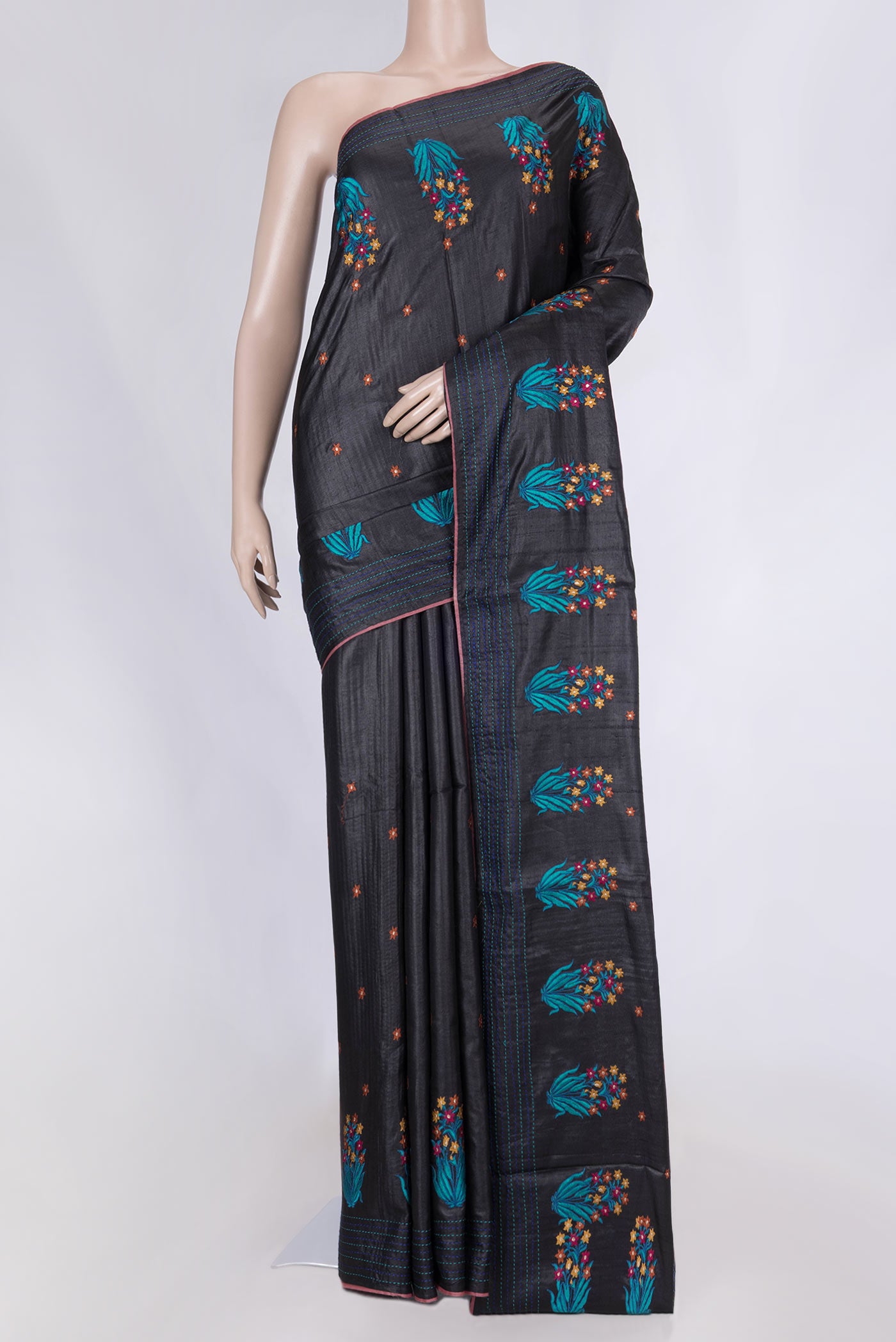 Black Tussar Silk Saree with Embroidery on the body and Embroidery Border displayed on a mannequin