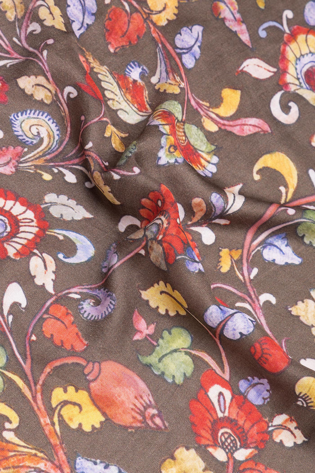 Close up of Grey kalamkari Saree with Printed design on the body and Zari Border.  displaying folds