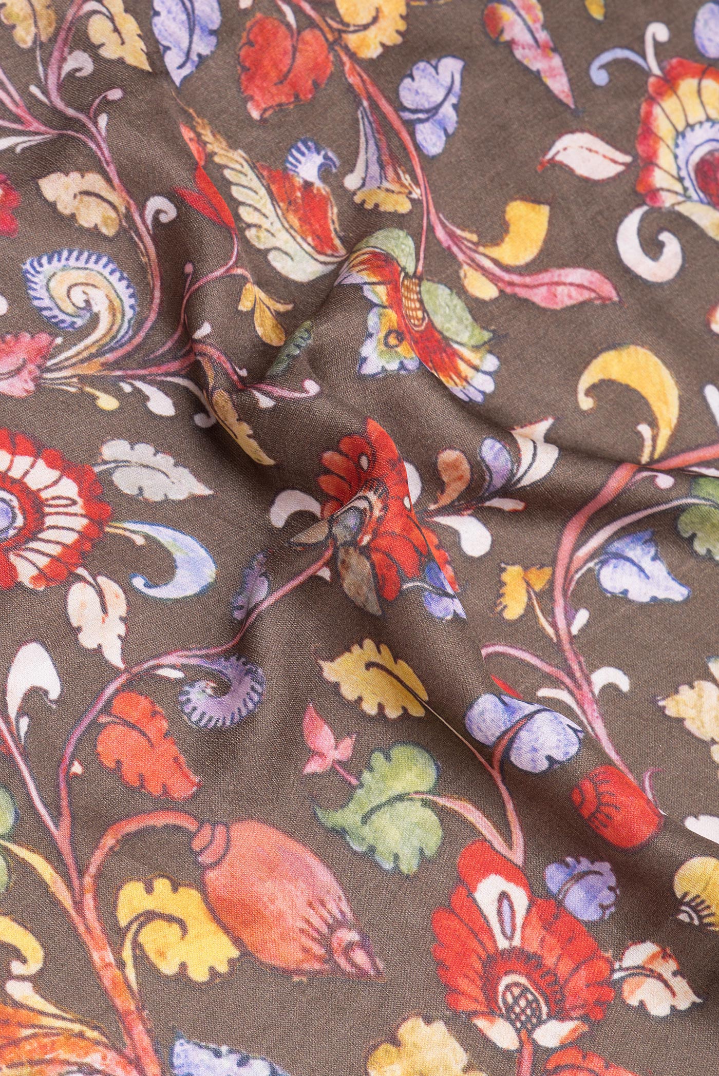 Close up of Grey kalamkari Saree with Printed design on the body and Zari Border.  displaying folds